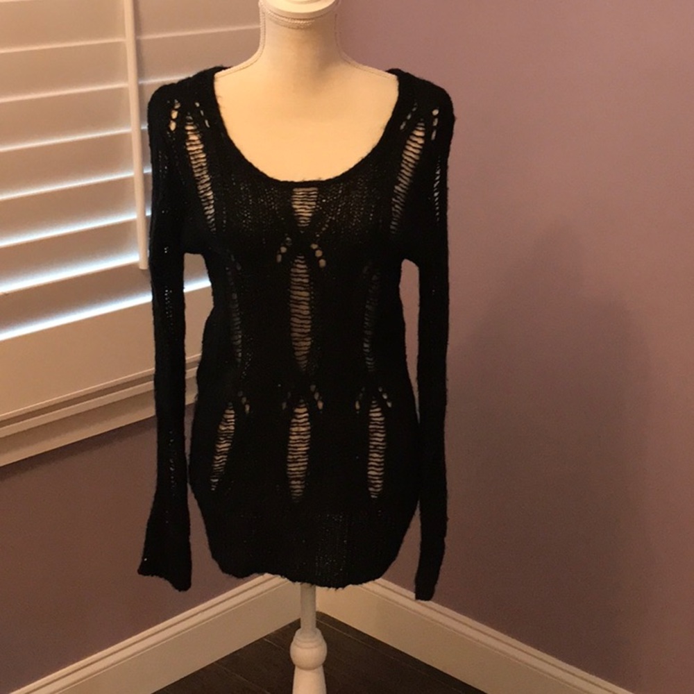 Jennifer Lopez, black, long sleeve sweater.